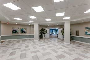 Toledo apartment for rent - A spacious office lobby with a checkered floor and white walls.
