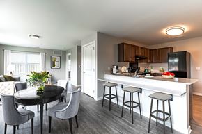 Toledo apartment for rent - A modern kitchen with a dining table and chairs.