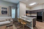 Union City apartment for rent - A modern kitchen with a dining table and chairs.