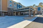 Union City apartment for rent - A large multi-story building with a covered walkway entrance.