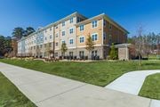 Union City apartment for rent - A large apartment complex with a walkway in front.