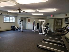 Atlanta apartment for rent - A gym with treadmills, elliptical machines, and other exercise equipment.