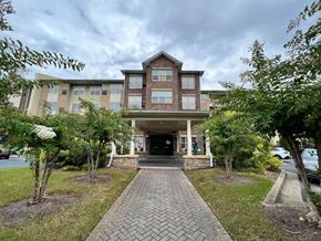 Atlanta apartment for rent - A brick building with a walkway in front of it.