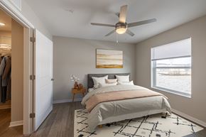 Hebron apartment for rent - A bedroom with a large bed and a ceiling fan.