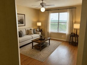 San Antonio apartment for rent - A living room with a couch, a coffee table, and a ceiling fan.