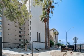 Phoenix apartment for rent - The image shows a modern building with a sign in front that reads "National Church Residences.".