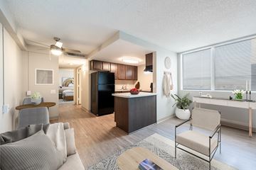Phoenix apartment for rent - A living room with a grey couch and a wooden table.