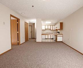 Whitehall apartment for rent - A sparsely furnished apartment with a kitchen area.