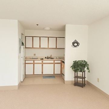 Sistersville apartment for rent - A kitchen with white cabinets and a sink.