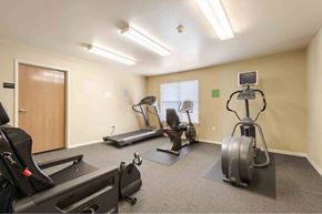 San Antonio apartment for rent - A well-equipped gym with treadmills, elliptical machines, and a stationary bike.