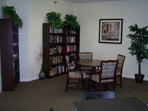 Fort Wayne apartment for rent - A room with a bookcase, a table and chairs.