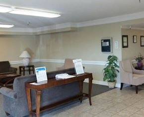 Glendale apartment for rent - A reception area with a couch, chair, and a coffee table.