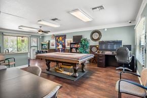 Wickenburg apartment for rent - A room with a table, chairs, and a fan.