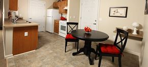 Dublin apartment for rent - A kitchen with a table and chairs in the middle of the room.