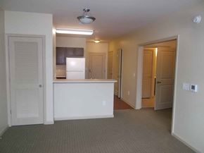 Atlanta apartment for rent - A kitchen area with a white refrigerator and a counter.
