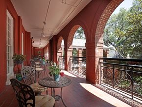 Savannah apartment for rent - A balcony with a table and chairs.