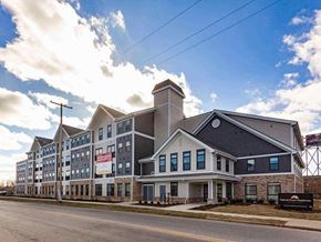 Columbus apartment for rent - A large building with a sign that says "The Inn at Penn" in front of it.