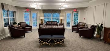 Atlanta apartment for rent - A living room with brown furniture and a carpet.