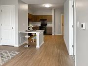 Columbus apartment for rent - A kitchen with a white countertop and wooden floors.