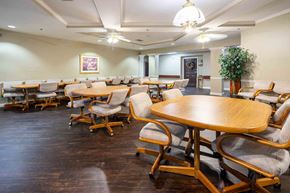 Cincinnati apartment for rent - A conference room with wooden tables and chairs.