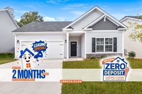 Irmo house for rent - a white house with a white garage door and a driveway