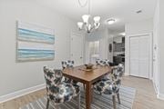 Virginia Beach apartment for rent - A dining room with a wooden table and chairs with a blue and white pattern at Saltmeadow Bay, Virginia Beach, Virginia
