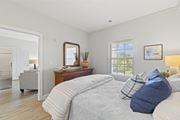 Virginia Beach apartment for rent - A bedroom with a large bed and a mirror on the dresser at Saltmeadow Bay, Virginia Beach, VA