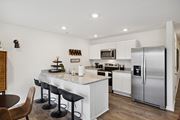 Oak Ridge apartment for rent - a kitchen with stainless steel appliances and a counter top with bar stools at Summit Place Apartments, Oak Ridge, TN, 37830