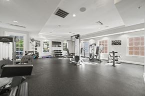 Williamsburg apartment for rent - A black and white photo of a gym with various exercise equipment  at Sterling Manor, Williamsburg, VA