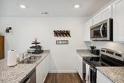 Oak Ridge apartment for rent - a kitchen with granite counter tops and stainless steel appliances at Summit Place Apartments, Oak Ridge, TN