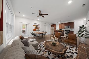 Asheville apartment for rent - A living room with a brown couch and a coffee table.