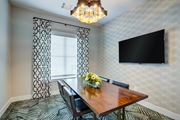 Commerce apartment for rent - A dining room with a wooden table and chairs.