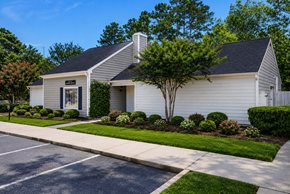 Augusta apartment for rent - A white building with a black roof and a tree in front.