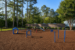 Augusta apartment for rent - A playground with a blue swing set and a red slide.