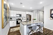 Madison apartment for rent - a kitchen with white cabinets and a white counter top at Farmhaus Apartments, Madison, 35757