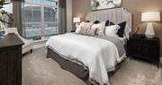 Lawrenceville apartment for rent - a bedroom with a bed and a window at The Flats at Southlawn Apartments, Georgia