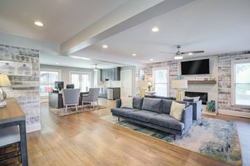 Martinez apartment for rent - A modern living room with a grey sofa and a fireplace.