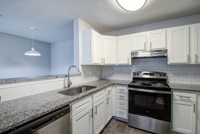 Martinez apartment for rent - A kitchen with a stove, sink, and cabinets.