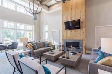 Hixson apartment for rent - A living room with a fireplace and a television mounted on the wall.
