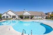 Hixson apartment for rent - A large swimming pool in front of a house.