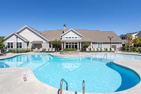 Hixson apartment for rent - A large swimming pool in front of a house.