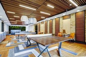 Prospect apartment for rent - A modern dining room with a wooden table and chairs.