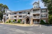 Chattanooga apartment for rent - A large apartment building with a parking lot in front.