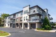 Chattanooga apartment for rent - A large apartment building with a parking lot in front.