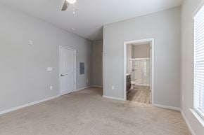 Augusta apartment for rent - A spacious room with a carpeted floor and a ceiling fan.