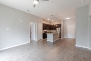Augusta apartment for rent - A spacious kitchen with a refrigerator, sink, and cabinets is visible.