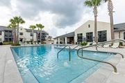 Santa Rosa Beach apartment for rent - A swimming pool with a metal ladder in the middle of it.
