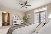 Williamsburg apartment for rent - A bedroom with a large bed and a ceiling fan  at Sterling Manor, Williamsburg, 23185