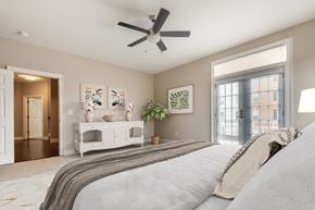 Williamsburg apartment for rent - A bedroom with a large bed and a ceiling fan  at Sterling Manor, Williamsburg, 23185
