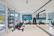 Woodbridge apartment for rent - a home gym with a large screen tv and exercise bikes at Rivergate, Woodbridge, VA